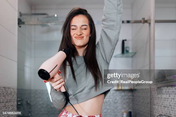 only good vibes - hand holding hair dryer stock pictures, royalty-free photos & images