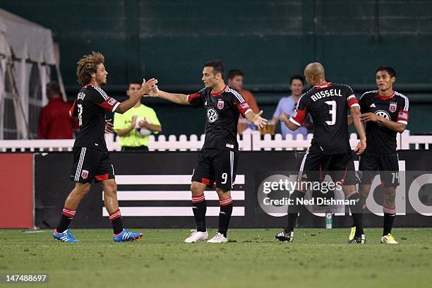 Hamdi Salihi of D.C. United celebrates with teammates after his goal against the Montreal Impact at RFK Stadium on June 30, 2012 in Washington, DC.