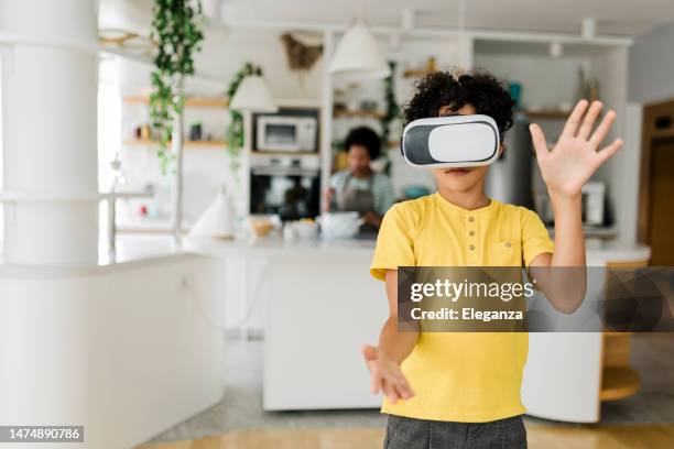 boy having fun while his mother cooking - virtual lunch stock pictures, royalty-free photos & images