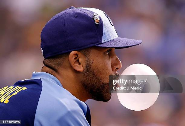 Pitcher David Price of the Tampa Bay Rays blows a bubble in the dugout against the Detroit Tigers during the game at Tropicana Field on June 30, 2012...