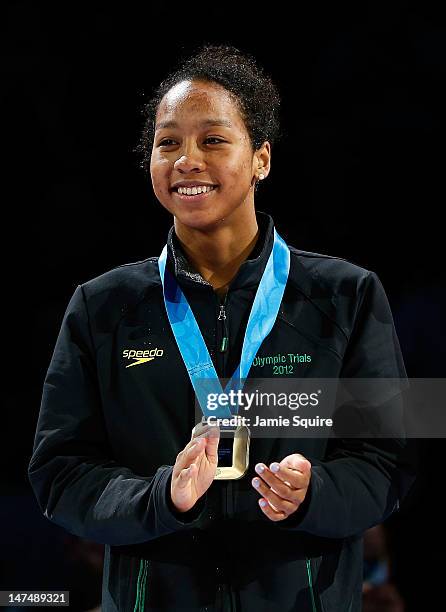 Lia Neal celebrates during the medal ceremony for the Women's 100 m Freestyle during Day Six of the 2012 U.S. Olympic Swimming Team Trials at...