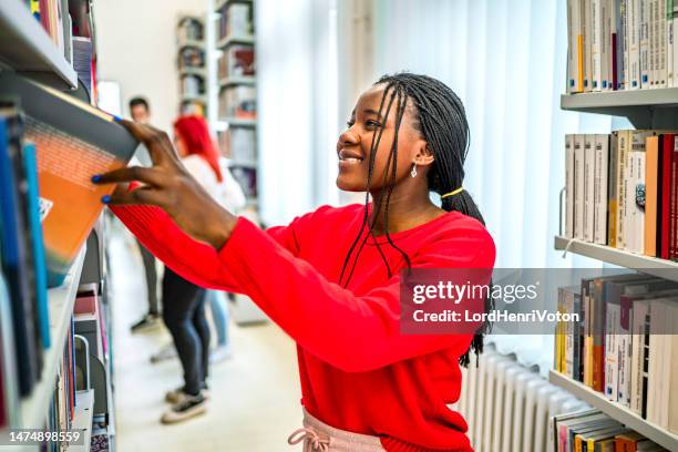 Reaching Books Reaching Book Shelf Photos and Premium High Res Pictures - Getty Images