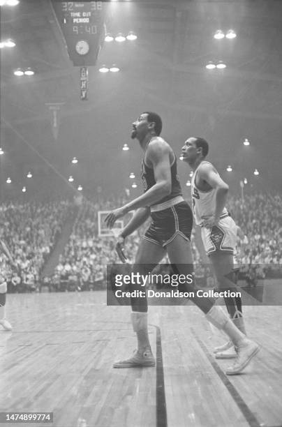 Philadelphia 76ers center Wilt Chamberlain and Nate Bowman of the Chicago Bulls at the International Amphitheatre on March 1, 1967 in Chicago,...