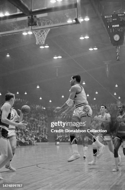 Hal Greer of the Philadelphia 76ers with Guy Rodgers and Jerry Sloan of the Chicago Bulls at the International Amphitheatre on March 1, 1967 in...