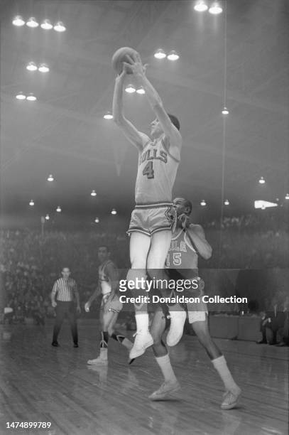 Guy Rodgers and Jerry Sloan of the Chicago Bulls and Hal Greer of the Philadelphia 76ers at the International Amphitheatre on March 1, 1967 in...