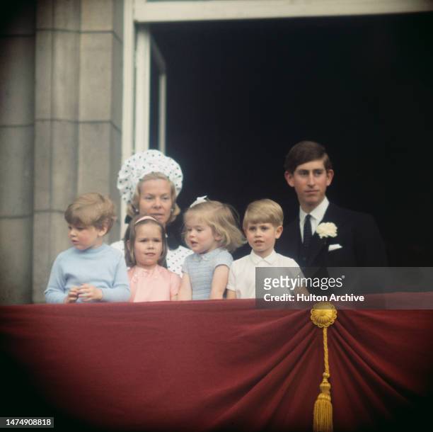 Prince Charles and Katharine, Duchess of Kent on the balcony of Buckingham Palace in London with a group of royal children, June 1968. From left to...