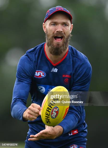 Max Gawn of the Demons handballs during a Melbourne Demons AFL training session at Casey Fields on March 21, 2023 in Melbourne, Australia.