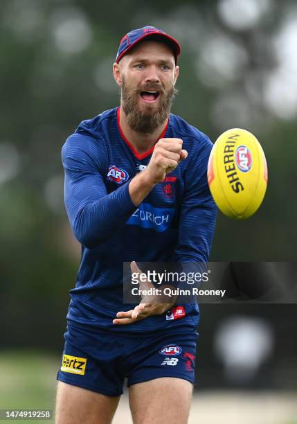 Max Gawn of the Demons handballs during a Melbourne Demons AFL training session at Casey Fields on March 21, 2023 in Melbourne, Australia.