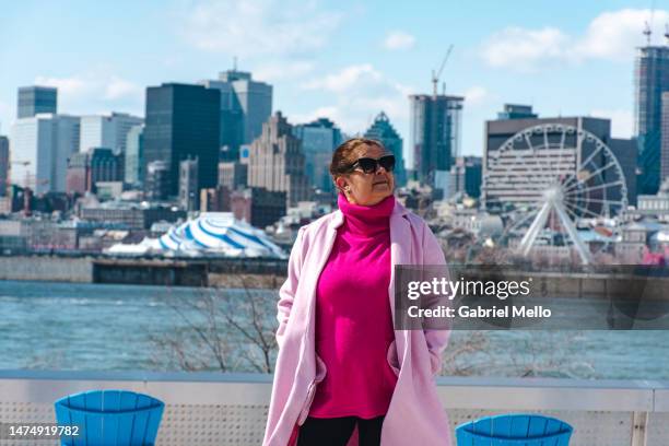 portrait of woman at park jean drapeau - drapeau quebec stock pictures, royalty-free photos & images