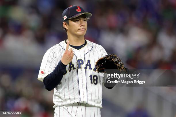 Yoshinobu Yamamoto of Team Japan reacts in the fifth inning against Team Mexico during the World Baseball Classic Semifinals at loanDepot park on...