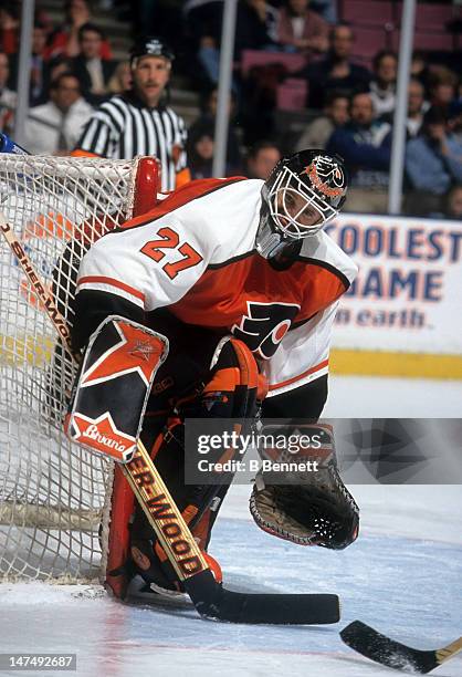 Goalie Ron Hextall of the Philadelphia Flyers defends the net during an NHL game against the New Jersey Devils circa 1998 at the Continental Airlines...