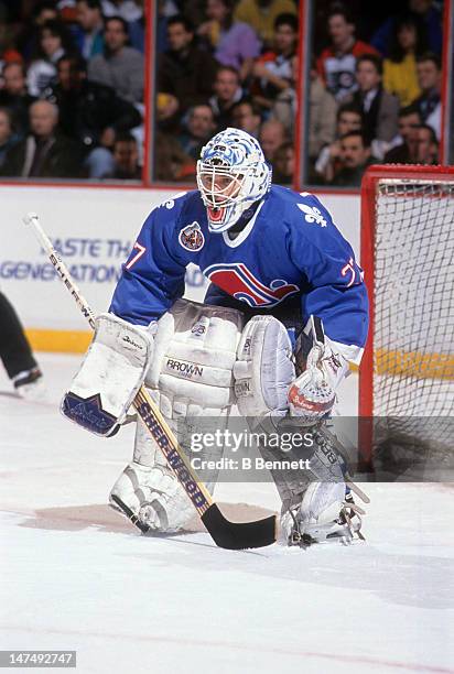 Goalie Ron Hextall of the Quebec Nordiques defends the net during an NHL game against the Philadelphia Flyers circa 1993 at the Spectrum in...