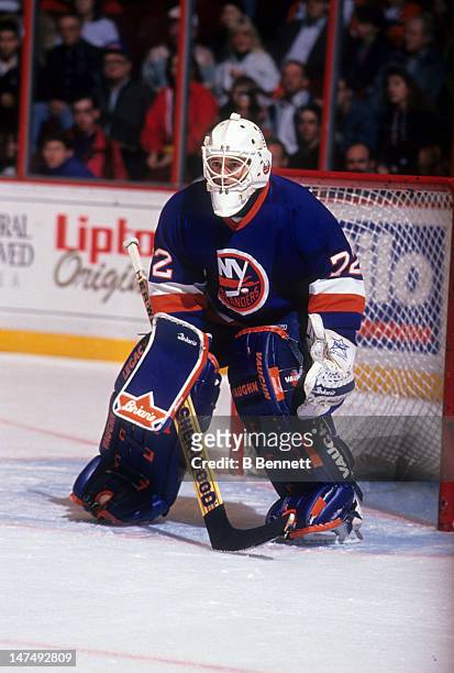 Goalie Ron Hextall of the New York Islanders defends the net during an NHL game against the Philadelphia Flyers circa 1994 at the Spectrum in...