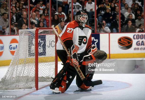 Goalie Ron Hextall of the Philadelphia Flyers defends the net during an NHL game in March, 1998 at the CoreStates Center in Philadelphia,...