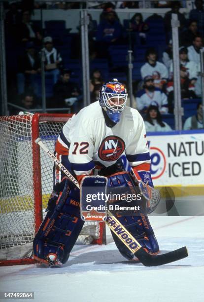 Goalie Ron Hextall of the New York Islanders defends the net during an NHL game circa 1994 at the Nassau Coliseum in Uniondale, New York.