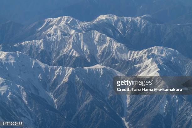 snowcapped akaishi mountains in shizuoka and nagano of japan aerial view from airplane - minami alps foto e immagini stock