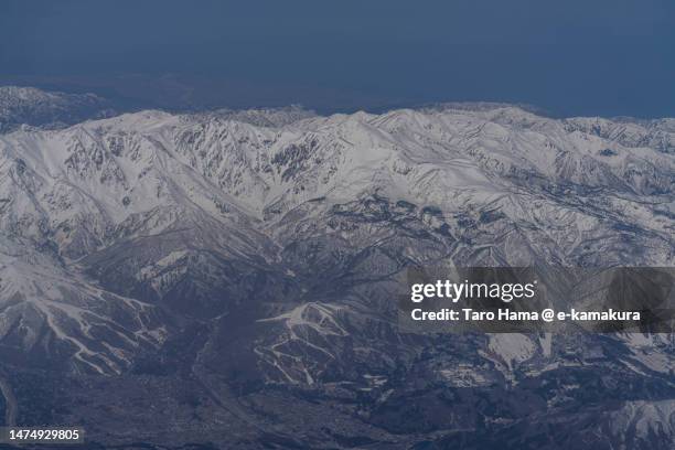 snowcapped hakuba mountain range in nagano of japan aerial view from airplane - hakuba fotografías e imágenes de stock