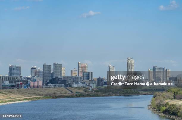 city buildings by the river in saitama of japan - uitzicht over stadje stockfoto's en -beelden