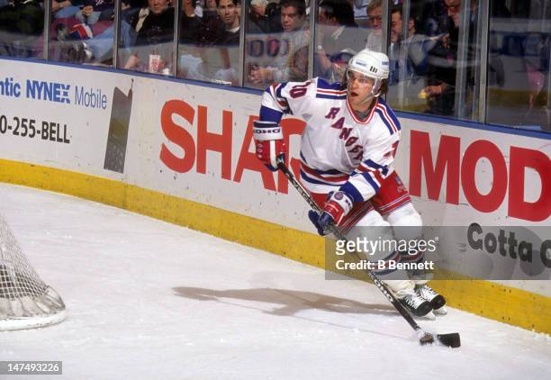 Luc Robitaille of the New York Rangers skates with the puck during an NHL game in January, 1996 at the Madison Square Garden in New York, New York.