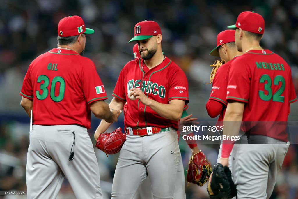 Benji Ries Baseball Manager Benji Gil makes a pitching change for Patrick Sandoval of ...