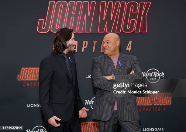 Keanu Reeves and Laurence Fishburne attends the Los Angeles Premiere of Lionsgate's "John Wick: Chapter 4" at TCL Chinese Theatre on March 20, 2023...