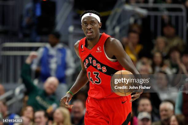 Pascal Siakam of the Toronto Raptors dribbles up court during the second half of the game against the Milwaukee Bucks at Fiserv Forum on March 19,...