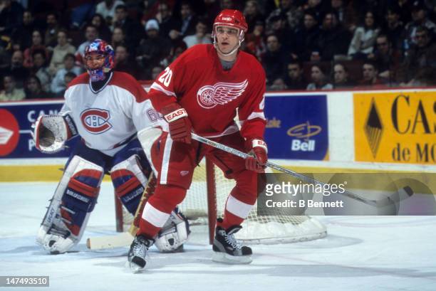 Luc Robitaille of the Detroit Red Wings sets up in front of goalie Jose Theodore of the Montreal Canadiens on February 11, 2002 at the Molson Centre...