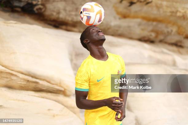 Awer Mabil juggles a ball as he poses during an Australian Socceroos media opportunity at Mrs Macquarie's Chair on March 21, 2023 in Sydney,...