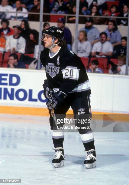 Luc Robitaille of the Los Angeles Kings skates on the ice during an NHL game against the New York Rangers circa 1994 at the Madison Square Garden in...