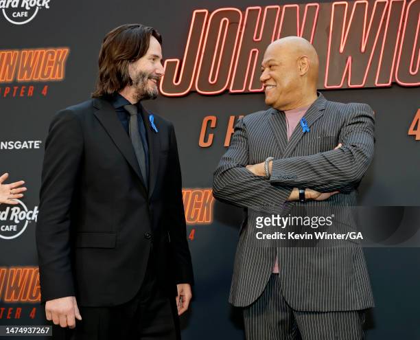 Keanu Reeves and Laurence Fishburne attends the Los Angeles Premiere of Lionsgate's "John Wick: Chapter 4" at TCL Chinese Theatre on March 20, 2023...