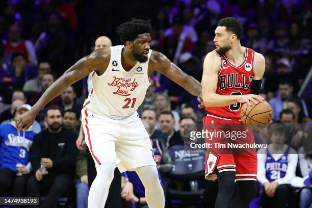 Joel Embiid of the Philadelphia 76ers guards Zach LaVine of the Chicago Bulls during the third quarter at Wells Fargo Center on March 20, 2023 in...