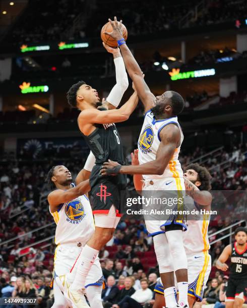 Draymond Green of the Golden State Warriors blocks the shot attempt of Kenyon Martin Jr. #6 of the Houston Rockets during the game at Toyota Center...