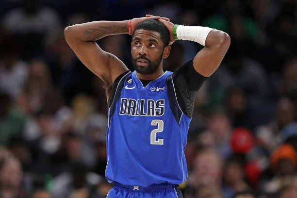 Kyrie Irving of the Dallas Mavericks looks on during the second half against the Memphis Grizzlies at FedExForum on March 20, 2023 in Memphis,...