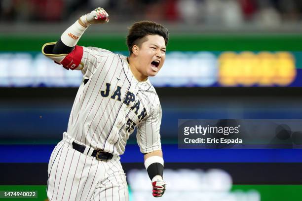Munetaka Murakami of Team Japan celebrates after hitting a two-run double to defeat Team Mexico 6-5 in the World Baseball Classic Semifinals at...