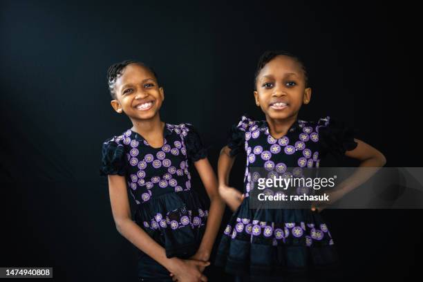 portrait happy teenage twin sisters - same person different looks stock pictures, royalty-free photos & images