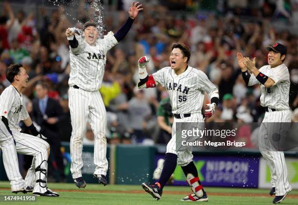 Munetaka Murakami of Team Japan celebrates with teammates after hitting a two-run double to defeat Team Mexico 6-5 in the World Baseball Classic...