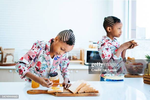 breakfast in the kitchen - identical twin stock pictures, royalty-free photos & images
