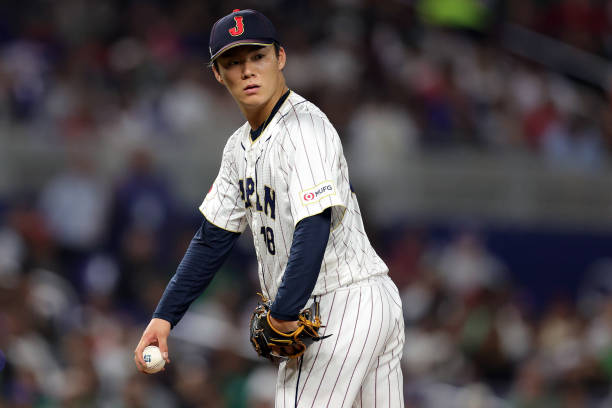 Yoshinobu Yamamoto of Team Japan looks on during the fifth inning against Team Mexico during the World Baseball Classic Semifinals at loanDepot park...