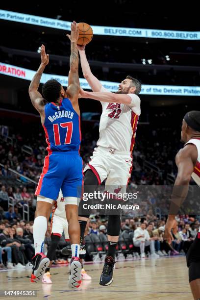 Kevin Love of the Miami Heat shoots the ball against Rodney McGruder of the Detroit Pistons at Little Caesars Arena on March 19, 2023 in Detroit,...