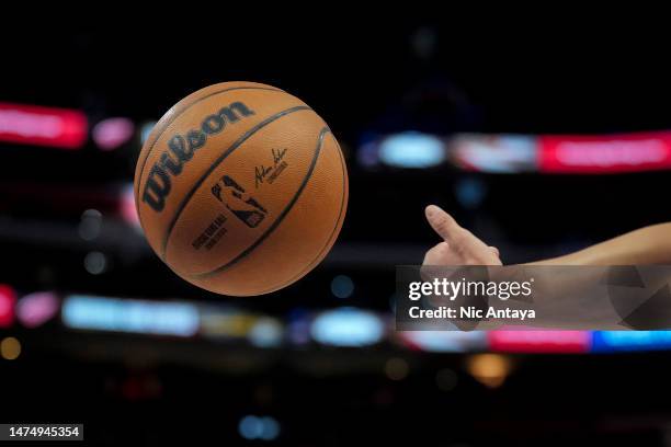 Referee throws a Wilson brand NBA basketball during the game between the Detroit Pistons and Miami Heat at Little Caesars Arena on March 19, 2023 in...