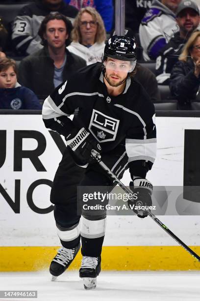 Adrian Kempe of the Los Angeles Kings skates with the puck during the first period against the Calgary Flames at Crypto.com Arena on March 20, 2023...