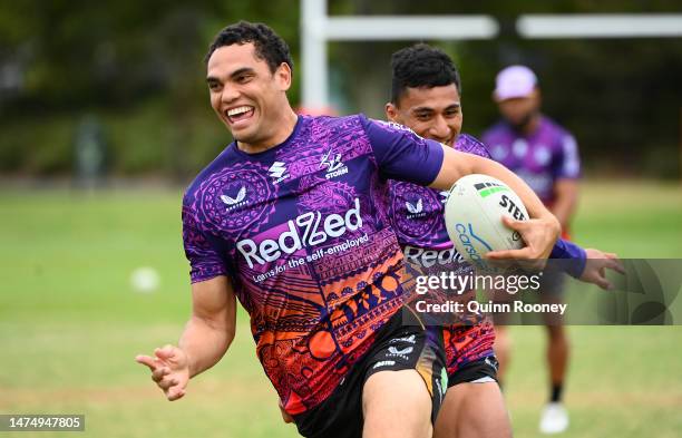 Xavier Coates of the Storm runs with the ball during a Melbourne Storm NRL training session at Gosch's Paddock on March 21, 2023 in Melbourne,...