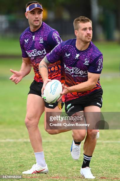 Cameron Munster of the Storm passes the ball during a Melbourne Storm NRL training session at Gosch's Paddock on March 21, 2023 in Melbourne,...