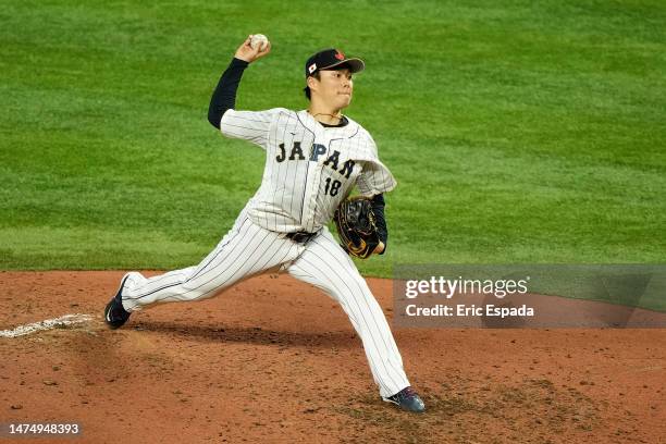 Yoshinobu Yamamoto of Team Japan delivers a pitch against Team Mexico during the fifth inning during the World Baseball Classic Semifinals at...