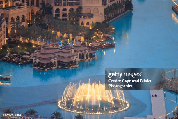 aerial view of dubai fountain light and sound show next to burj khalifa and dubai mall - dubai fountain stock pictures, royalty-free photos & images