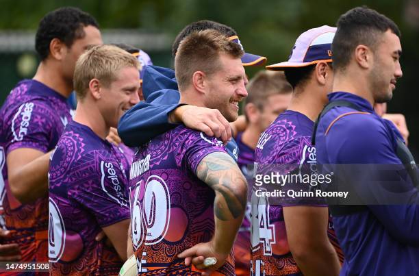 Cameron Munster of the Storm stands with team mate during a Melbourne Storm NRL training session at Gosch's Paddock on March 21, 2023 in Melbourne,...