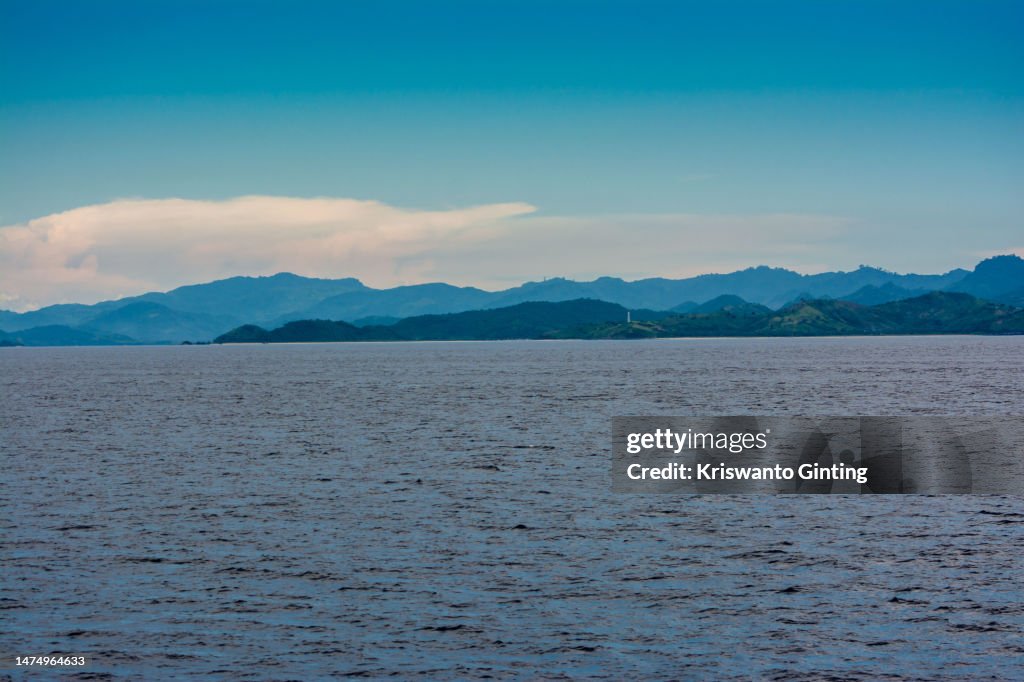 Mountains gradation with blue Sky Over the Blue Ocean