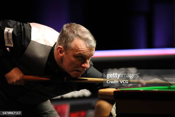 Mark Davis of England plays a shot in the second round match against Mark Allen of England on day 5 of 2023 WST Classic at the Morningside Arena on...