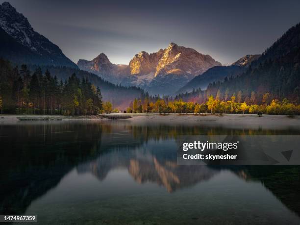 alpine lake of jasna in kranjska gora, slovenia. - triglav slovenia stock pictures, royalty-free photos & images