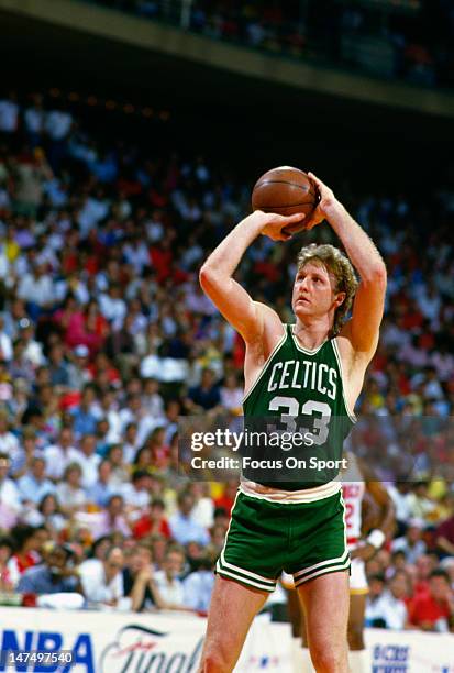 Larry Bird of the Boston Celtics shoots against the Houston Rockets during an NBA Finals June 1986 at The Summit in Houston, Texas. Bird played for...